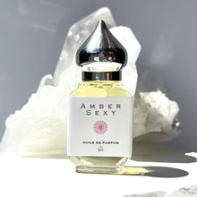 Load image into Gallery viewer, The Parfumerie offers Amber Sexy. A Riddle Oil. A 10 ml Gift Bottle with a shiny pointed silver top.
