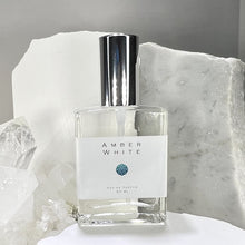 Load image into Gallery viewer, Amber White 2 oz Eau de Parfum. This 60 ml luxury perfume bottle is blended with organic cane alcohol.