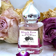 Load image into Gallery viewer, A beautiful blend of rose attars from India including notes of Bulgarian Rose. Available in a 15 ml gift bottle upon request.