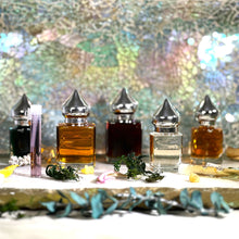 Load image into Gallery viewer, The Parfumerie's Perfume bottle options for Ouds are 1 ml Sample Vial, 8 ml and 15 ml Gift Bottles with pointed, shiny caps.