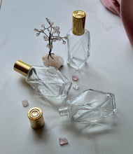 Cargar imagen en el visor de la galería, Glass Bottles with Gold Caps. 1 lying down to show the neck of the bott.e
