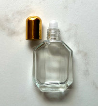 Load image into Gallery viewer, Half ounce clear Perfume Bottle with a Roll On application.