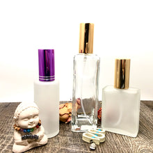Cargar imagen en el visor de la galería, Assorted Perfume Bottles. Our focus is the 2 oz. Perfume Spray bottle. Frosted Glass with Purple Atomizer Sprayer Top and Over Cap for Perfume Oils, Essential Oils or Fragrance Oils.