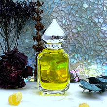 Load image into Gallery viewer, A 10 ml Gift Bottle option has a clear glass perfume bottle with a pointed crown cap.
