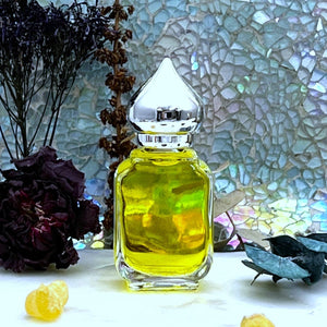 Arabian Sandalwood 10 ml Gift Bottle option has a clear glass perfume bottle with a pointed crown cap.