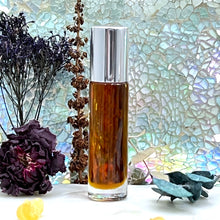 Load image into Gallery viewer, 1001 Nights Perfume Oil. 10 ml Roll On Bottle comes in a clear bottle with a steel rollerball and silver shiny cap.