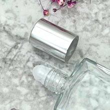 Load image into Gallery viewer, A great empty bottle for oils with a plastic roller ball and silver cap. The perfect travel perfume bottle.