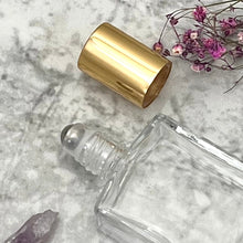 Load image into Gallery viewer, This 15 ml roller comes with a clear rectangle perfume bottle, steel roller ball and gold cap.