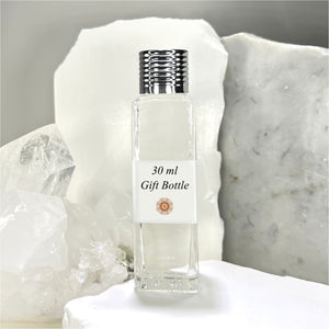 The Parfumerie offers a 30 ml Gift Bottle made of clear glass with a silver ribbed cap. A luxury perfume bottle.