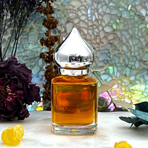 1001 Nights Perfume Oil.  8 ml Gift Bottle option has a clear glass perfume bottle with a pointed crown cap. Great for Essential Oils too!