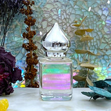 Load image into Gallery viewer, Indian Vetiver Perfume Oil at The Parfumerie in a clear perfume bottle with a pointed cap. Elegant.