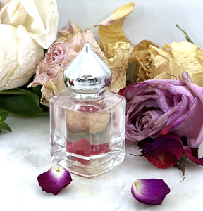 8 ml Gift Bottle Rose Perfume. A clear glass Perfume Bottle with a pointed crown cap.