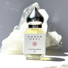 Load image into Gallery viewer, The Parfumerie offers Amber Sexy. A Riddle Oil. A 10 ml Gift Bottle with a shiny pointed silver top. 