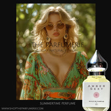 Load image into Gallery viewer, Amber Sexy perfume oil. Sexy oil for a sexy woman in the photo with sunglasses and a summer dress.