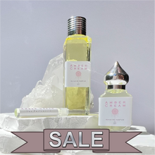 Load image into Gallery viewer, The Parfumerie offers Amber Cream Perfume Oil on SALE. Enjoy $10.00 off of this Unisex Perfume. Riddle Oil. Riddle Amber.