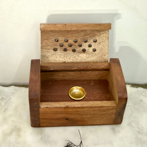 A unisex Cone Burner with a brass plate to hold the incense cone.