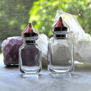 The Parfumerie offers 10 ml and 15 ml Clear Glass Perfume Bottles with Silver Pointed Minaret Caps. Elegant and Beautiful!
