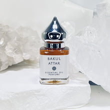 Load image into Gallery viewer, Our 8 ml. size is perfect size for traveling or even to fit in your pocket.  Bakul attar is all natural essential oil perfume