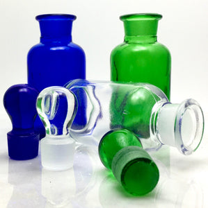 A refillable green glass bottle or blue glass bottle or clear glass bottle.