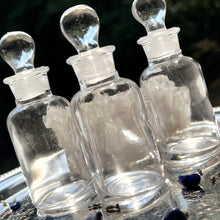 Load image into Gallery viewer, CLEAR Glass Apothecary Bottles in one ounce size on a silver tray sparkling in the sunshine.