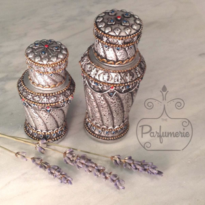 Resin Perfume Bottles with glass interior in sizes 6ml and 12ml. Silver color we also carry Bronze. These Bottles can hold Perfume Oils, Attars and Ouds.