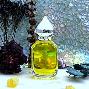 Jannatul Naeem 10 ml Gift Bottle has a clear glass perfume bottle with a pointed crown cap. Great for Essential Oils too!