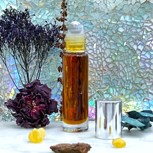 Marrakesh Perfume Oin in a 10 ml Clear Glass Roller Bottle with Stainless Steel Rollerball Insert and Silver Cap.