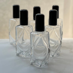 High quality glass Diamond perfume bottles made in Italy. Black Caps. These will store your Essential Oils, Perfume Oils and Fragrance Oils.
