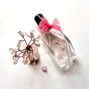Diamond style Glass Bottles with Pink Tule and Rose Quartz inside. A great idea for a gift.