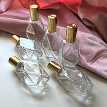 Load image into Gallery viewer, Several Diamond Perfume Bottles in different positions to show off the different aspects of the bottle.