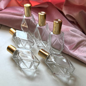 Several Diamond Perfume Bottles in different positions to show off the different aspects of the bottle.