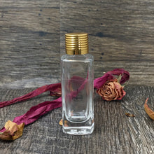 Load image into Gallery viewer, 30ml Gift Bottle. Clear Glass Perfume Bottle accented with a beautiful gold ribbed cap.