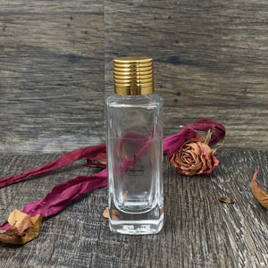 30ml Gift Bottle. Clear Glass Perfume Bottle accented with a beautiful gold ribbed cap.