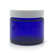 Load image into Gallery viewer, 1 oz. Cobalt blue straight sided cosmetic jar with white lid. High quality UV proof glass. Safe for all essential oil products.