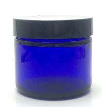 Load image into Gallery viewer, 1 oz. Cobalt blue straight sided cosmetic jar with black lined lid. High quality UV proof glass. Safe for all essential oil products.