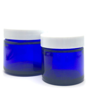 1 oz. Cobalt blue straight sided cosmetic jar with white lined lid option. High quality UV proof glass. Safe for all essential oil products.