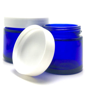 1 oz. Cobalt blue straight sided cosmetic jar with lined lid options. High quality UV proof glass. Safe for all essential oil products.