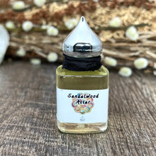 Load image into Gallery viewer, 15 ml size of Sandalwood Attar Essential oil perfume. 100% completely botanical, no synthetic chemicals and is made with the finest Mysore Sandalwood. 