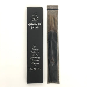 Essential Oil Incense black box next to a black zip lock bag full of 20 Essential Oil Incense Sticks for days of Aromatherapy!
