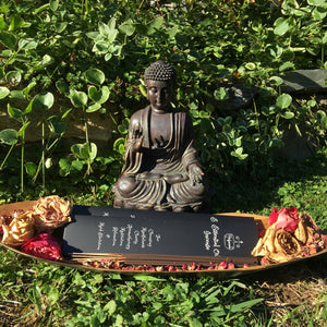 A beautiful Gift Idea. A Buddha statue Incense Holder behind a couple Gift Boxed Essential Oil Incense. The Perfect Gift!