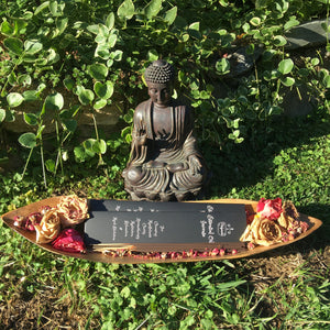 A beautiful display of a Buddha statue Incense Holder behind a tray full of Essential Oil Incense. Long burning aroma.