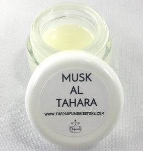 1/4 oz. Clear Glass Jar of Musk Al Tahara Perfume. Clear jar with a white lid.