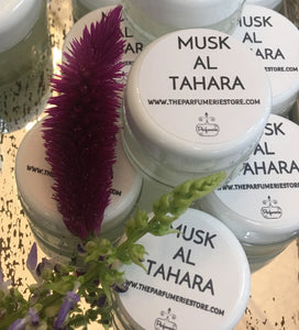 1/2 oz. Jars of Musk Al Tahara Perfume. Clear jars with a white lid